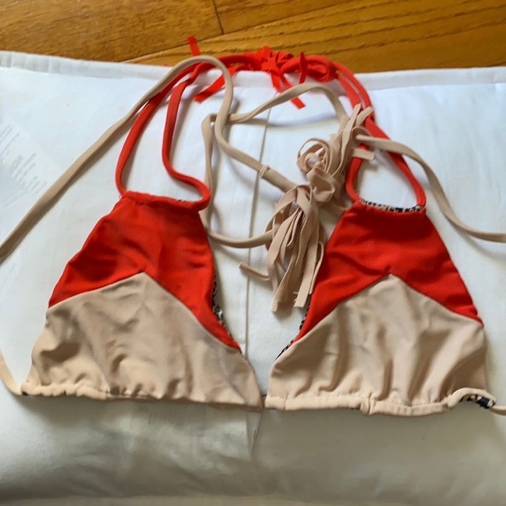 Acacia top. Never worn. Size small. Triangle top. Adjustable ties.